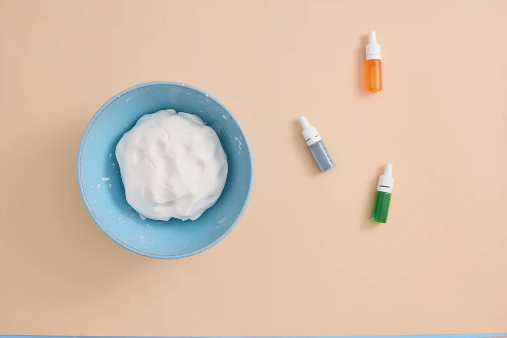 cloud dough in a blue bowl