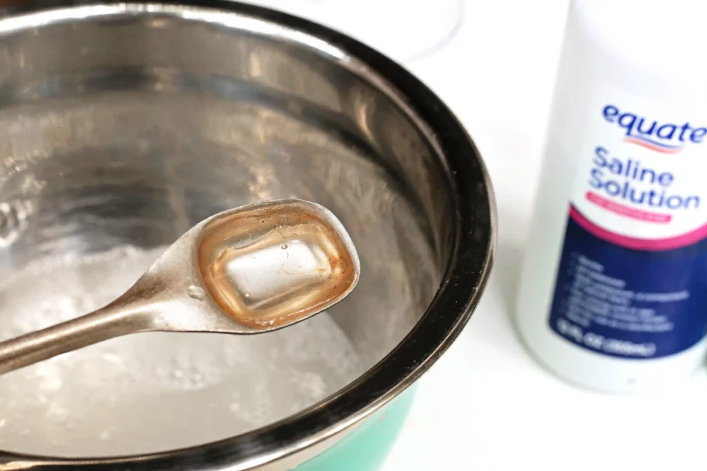 contact solution being added to a mixing bowl