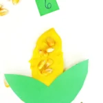 a fall counting activity for preschoolers that has corn kernels in playdough that looks like corn