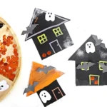 cardboard painted and decorated to look like haunted houses