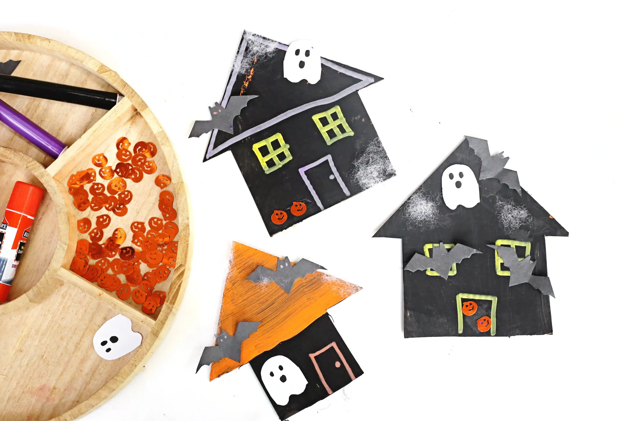 cardboard painted and decorated to look like haunted houses