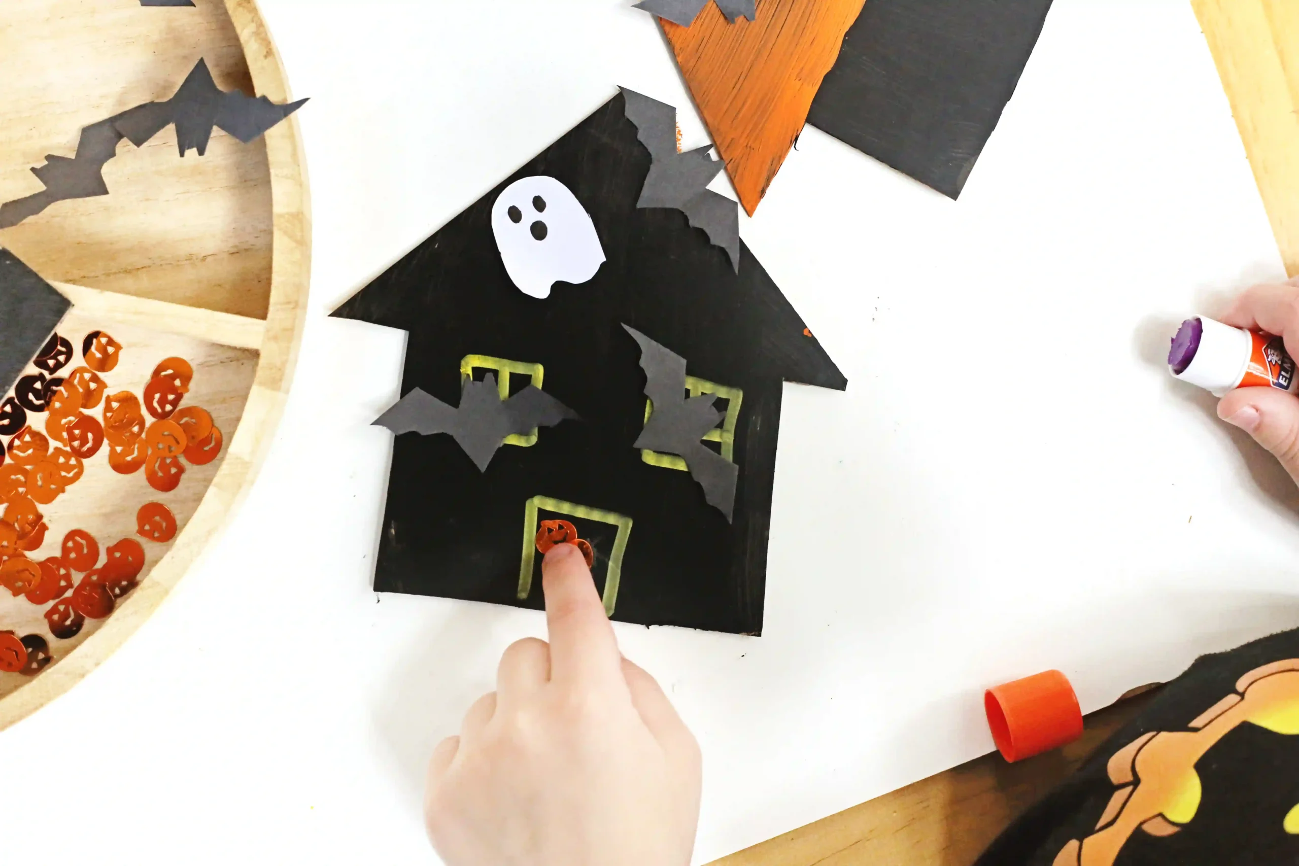 cardboard painted and decorated to look like haunted houses