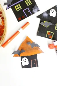 cardboard painted and decorated to look like haunted houses
