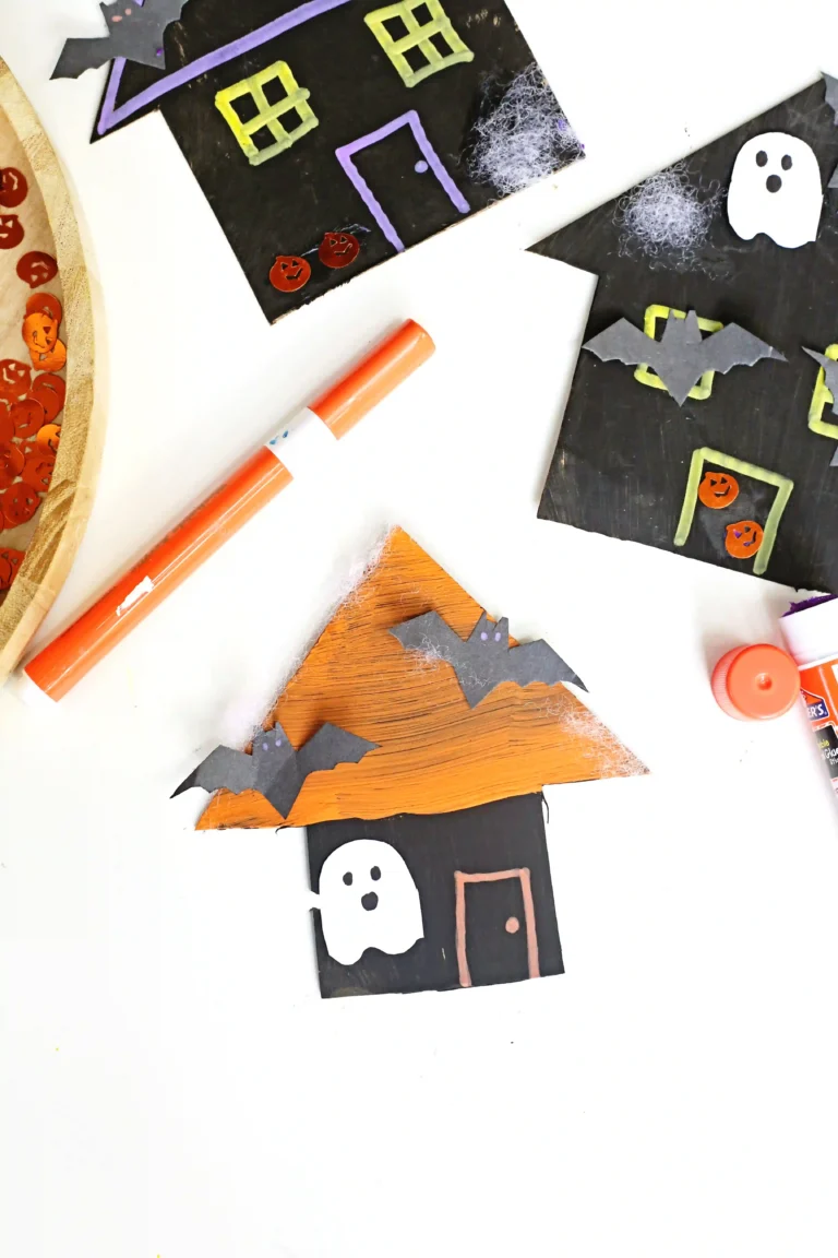 cardboard painted and decorated to look like haunted houses