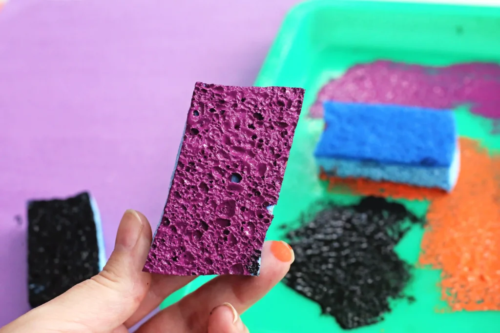 a sponge dipped in purple paint
