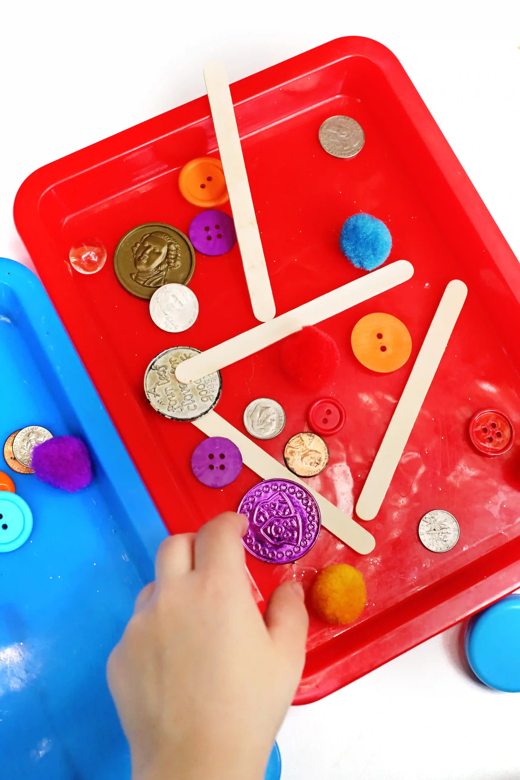a Magnetic Sorting STEM Activity where a kid uses a magnet to determine what is magnetic and what isn't
