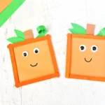 Spookley the Square Pumpkin Popsicle Stick Craft that uses orange popsicle sticks, green and orange construction paper, and googly eyes to make a square pumpkin