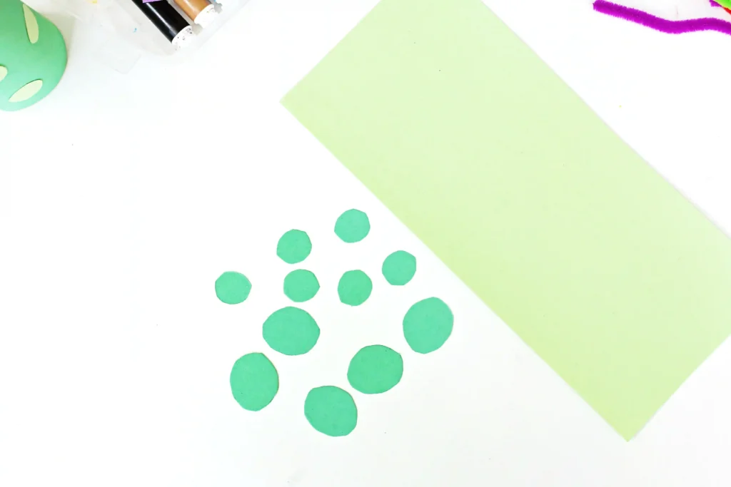 green construction paper cut into a strip and circles