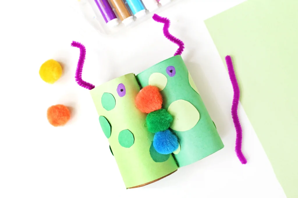 Monster Binoculars made out of toilet paper rolls, pom poms, construction paper, and pipe cleaners