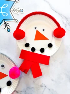 paper plates decorated to look like snowmen