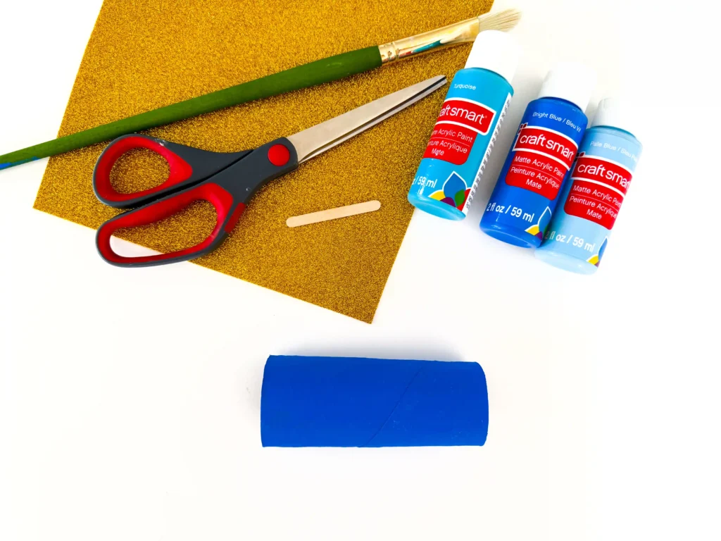 a toilet paper roll painted blue