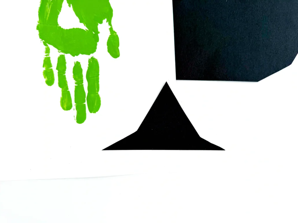 a witch hat cut out of black construction paper