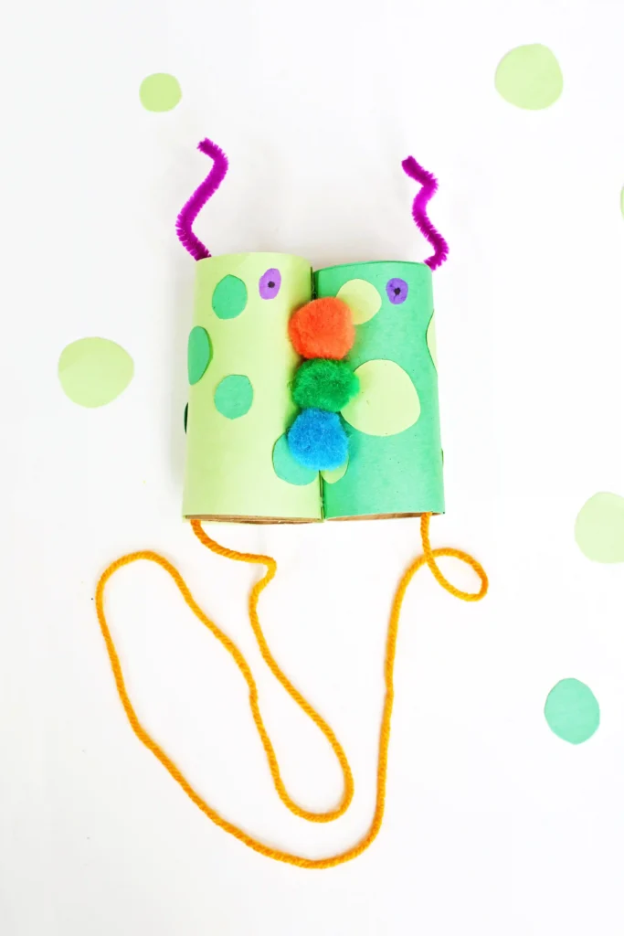Monster Binoculars made out of toilet paper rolls, pom poms, construction paper, and pipe cleaners