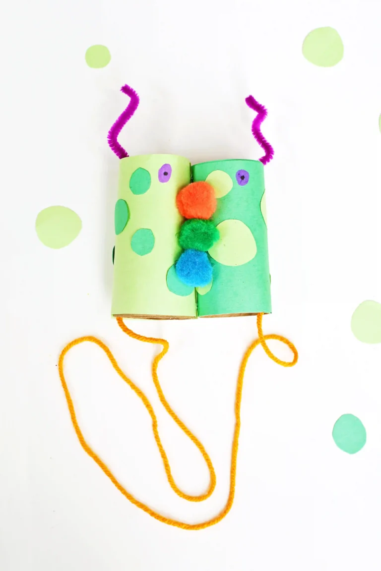 Monster Binoculars made out of toilet paper rolls, pom poms, construction paper, and pipe cleaners