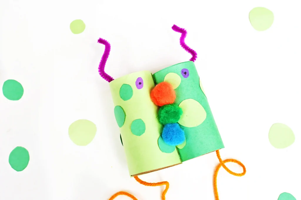 Monster Binoculars made out of toilet paper rolls, pom poms, construction paper, and pipe cleaners