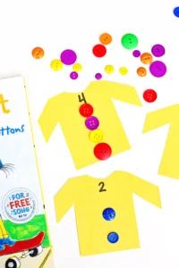 a Pete the Cat Counting Activity that has yellow shirts cut out of construction paper with numbers and buttons