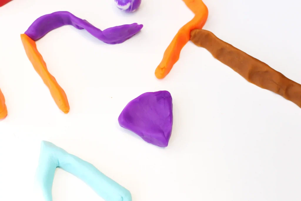 a pinball game made out of playdough with a marble
