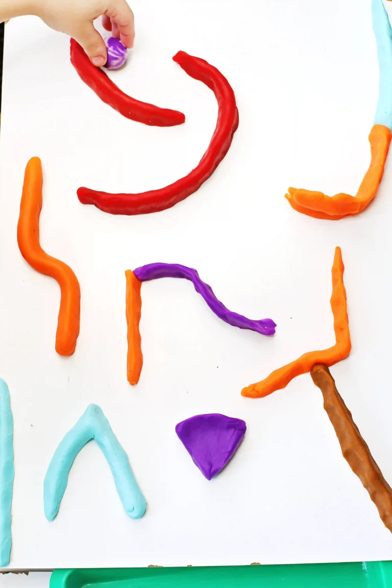 a pinball game made out of playdough with a marble