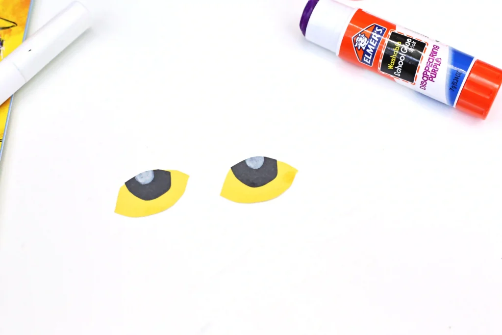 eyes made out of black and yellow construction paper