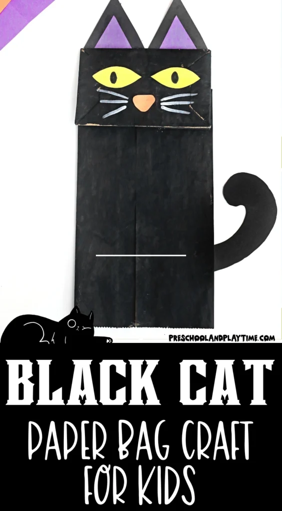 a paper bag painted black and decorated to look like a cat