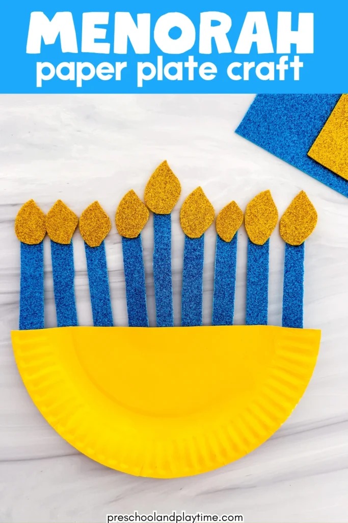 a paper plate painted yellow with glittery candles to look like a menorah
