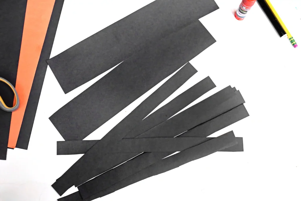 strips of black construction paper