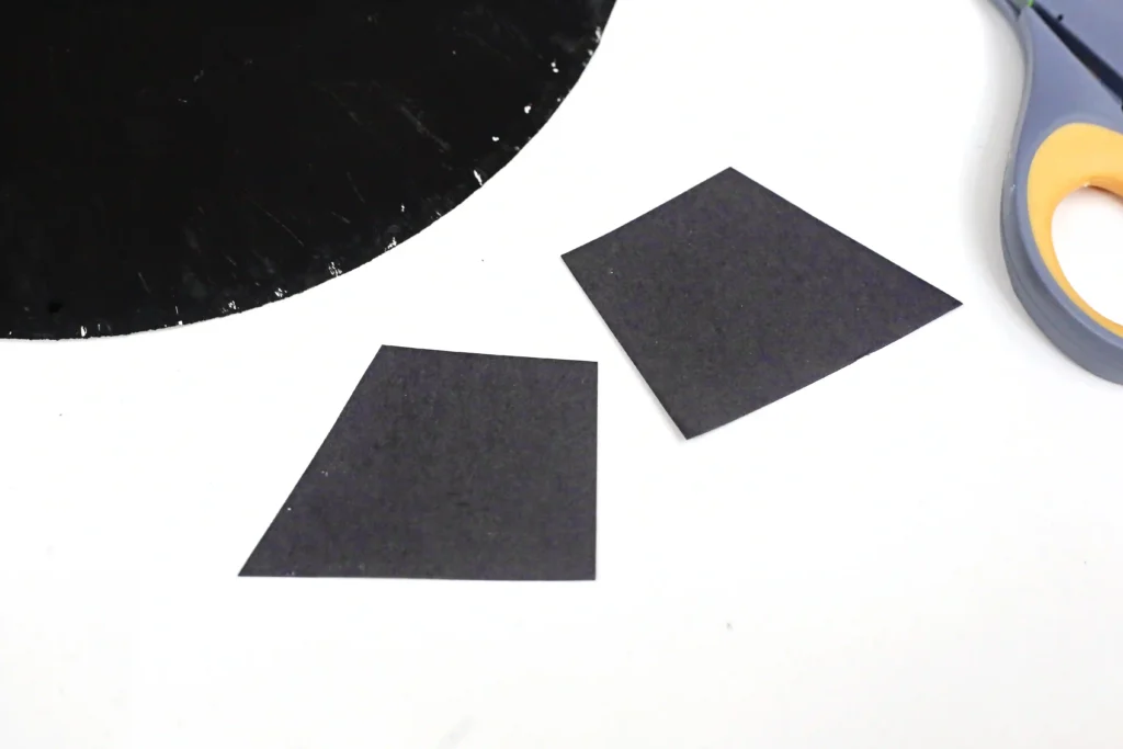 cauldron legs cut out of black construction paper