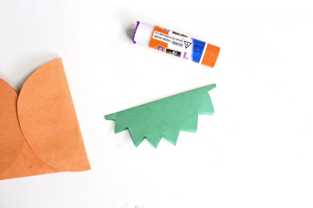 green construction paper cut with jagged edges