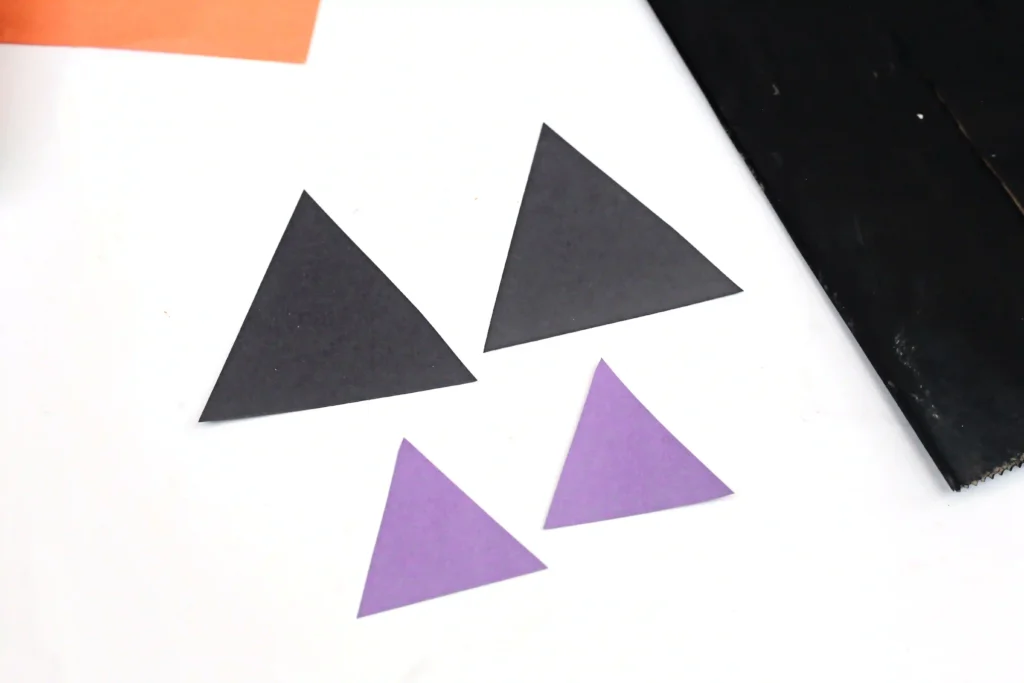 triangles cut from black and purple construction paper