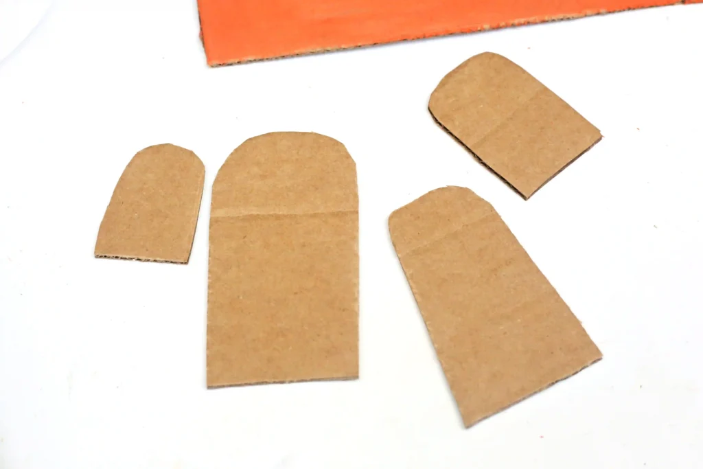 ghost shapes cut out of cardboard