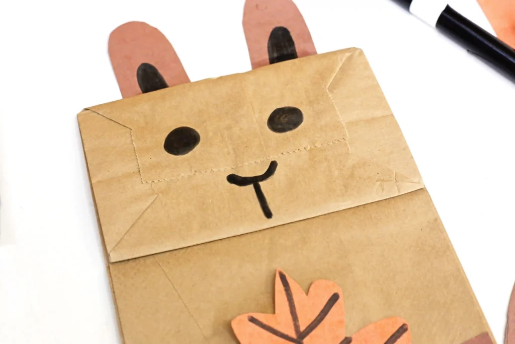 a squirrel face drawn on a paper bag