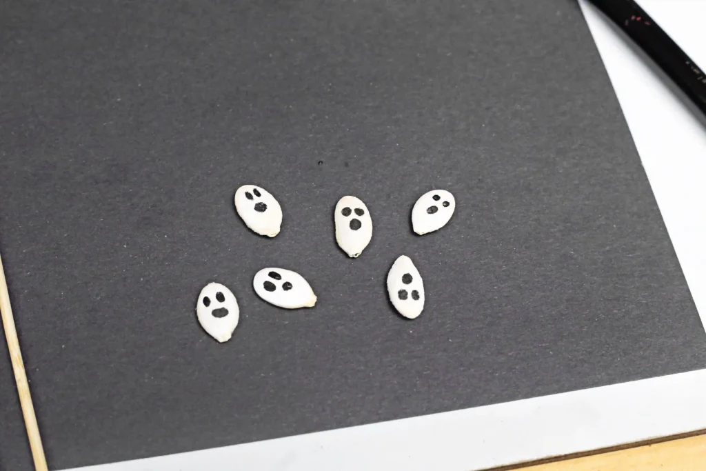 pumpkin seeds with ghost faces on them
