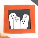 a Ghost Family Portrait Craft made out of cardboard and construction paper
