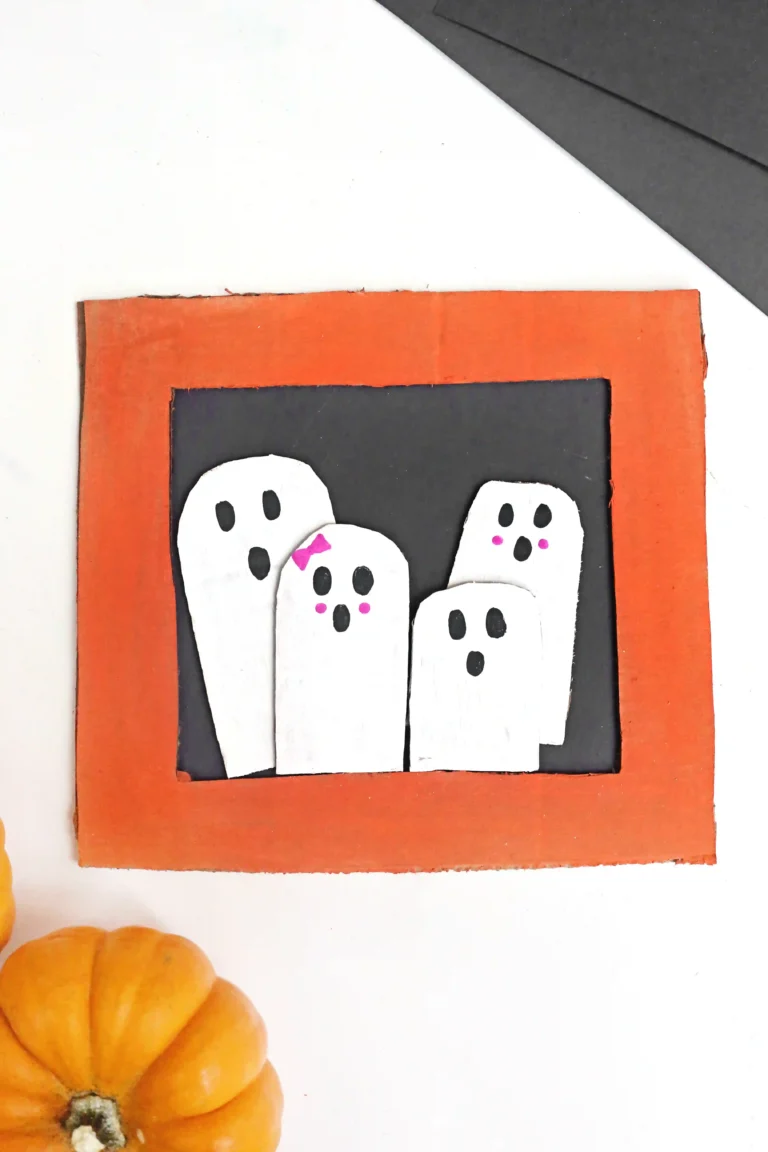 a Ghost Family Portrait Craft made out of cardboard and construction paper