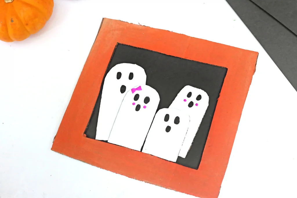 a Ghost Family Portrait Craft made out of cardboard and construction paper