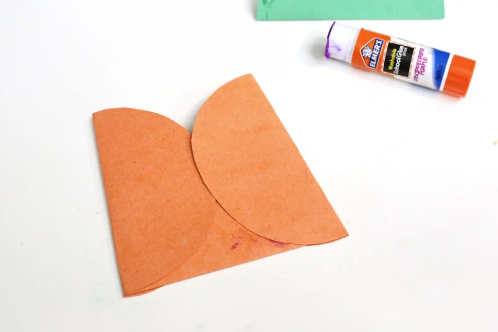orange construction paper circles glued together