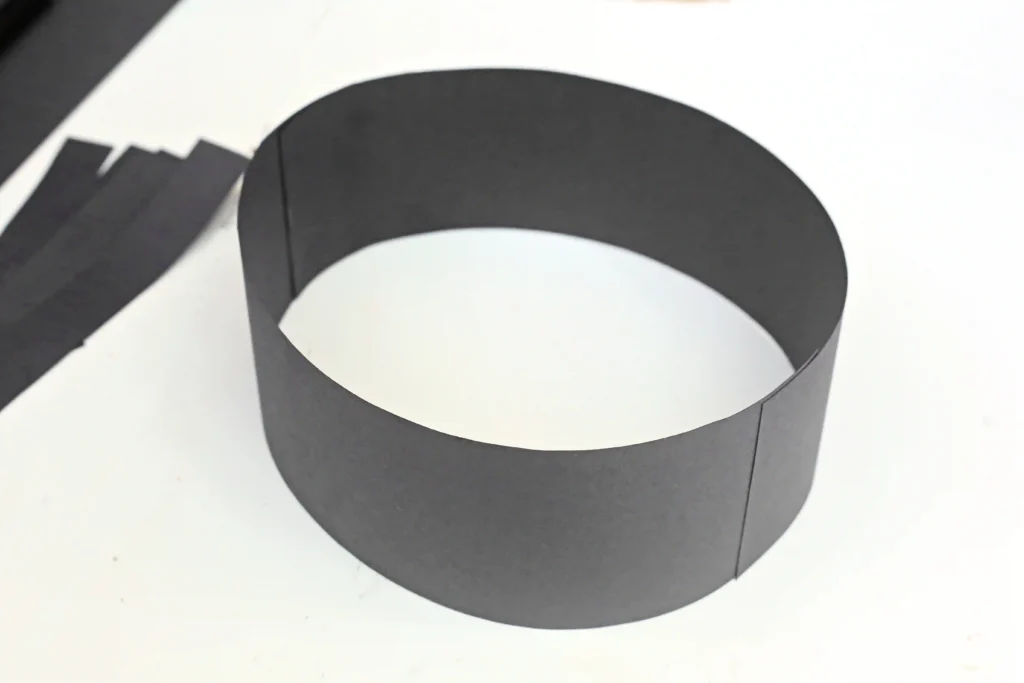 a black piece of construction paper turned into a headband