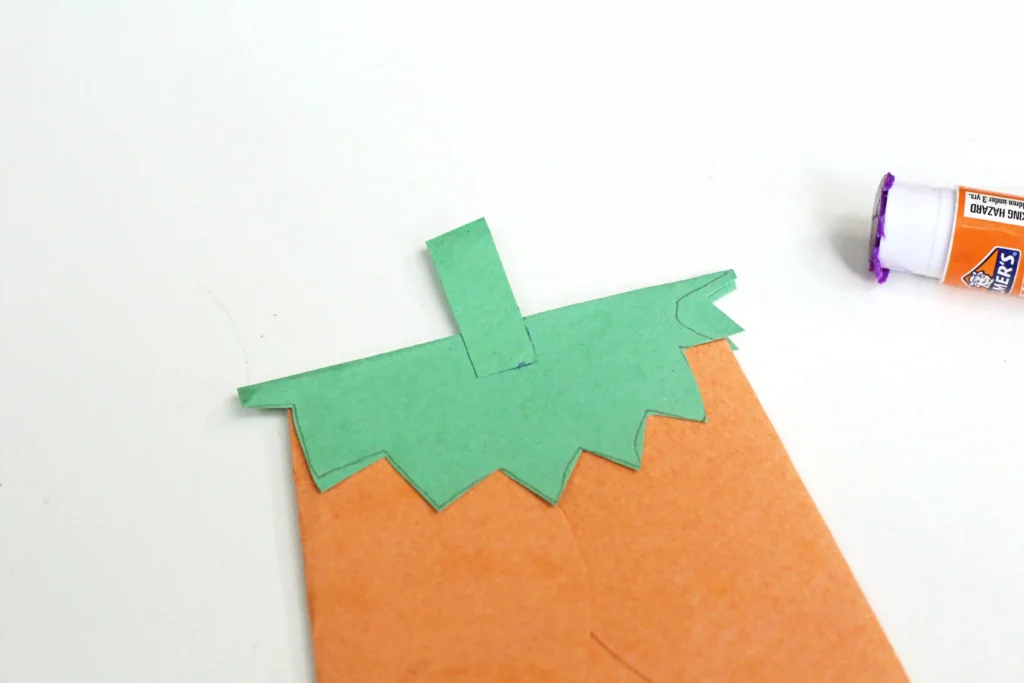 a construction paper envelop that looks like a jack-o-lantern