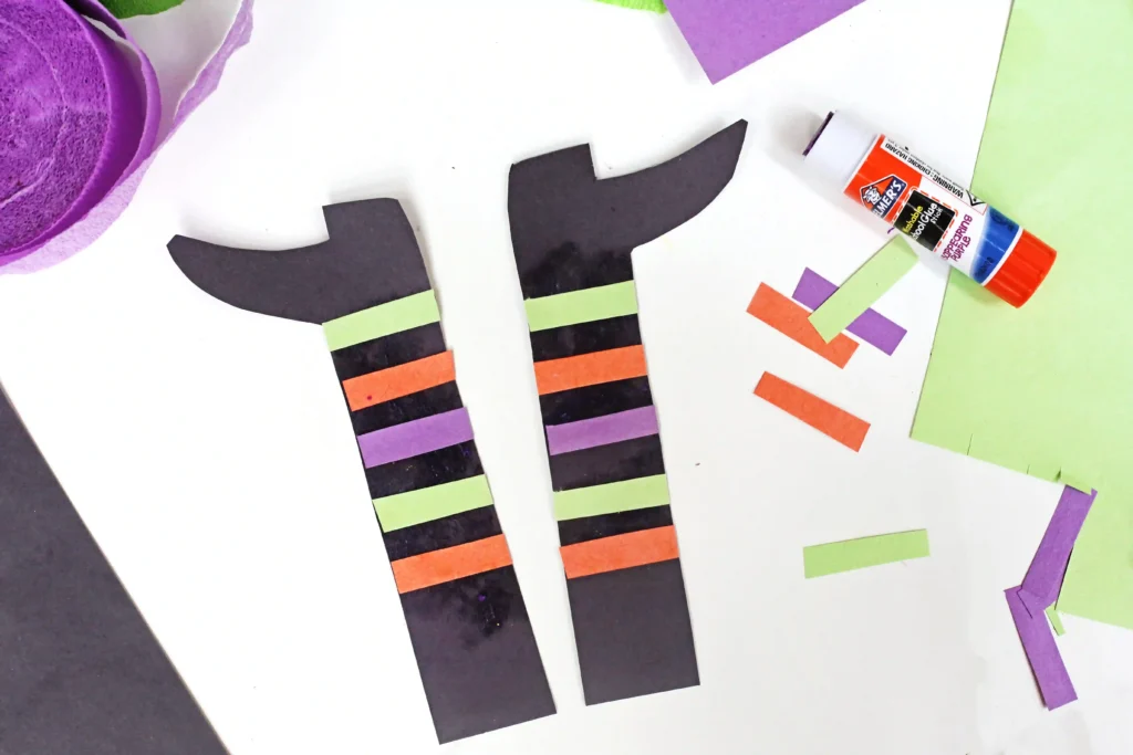 witch legs with striped socks made out of construction paper