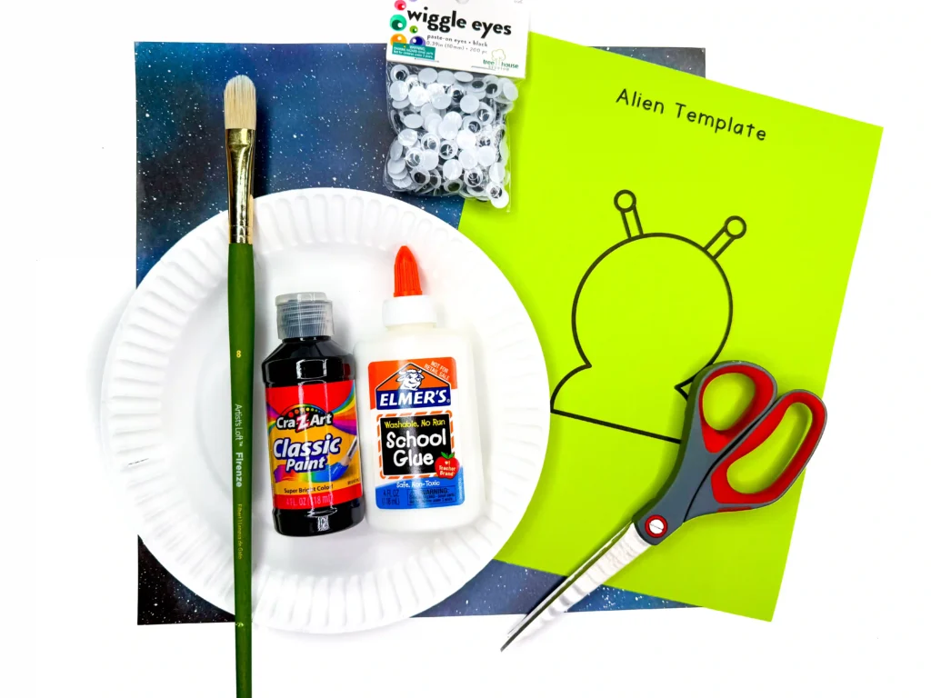 supplies for the u.f.o. alien craft: a paper plate, black paint, paintbrush, scissors, glue, googly eyes and the printable alien template