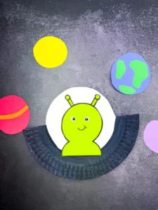 a U.F.O. Alien Craft made out of a paper plate with an alien inside