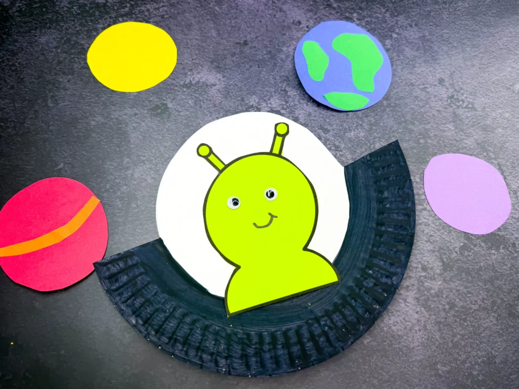 a U.F.O. Alien Craft made out of a paper plate with an alien inside