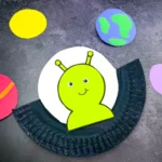 a U.F.O. Alien Craft made out of a paper plate with an alien inside