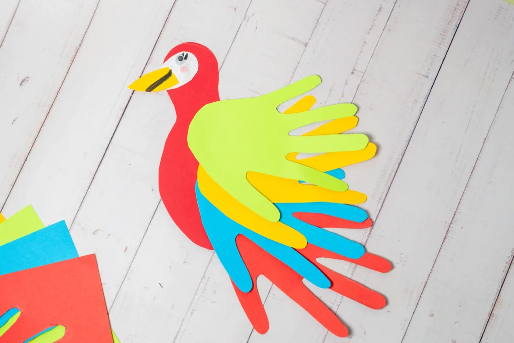 a Parrot Handprint Craft made out of colored construction paper