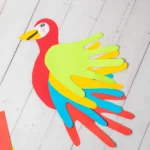 a Parrot Handprint Craft made out of colored construction paper