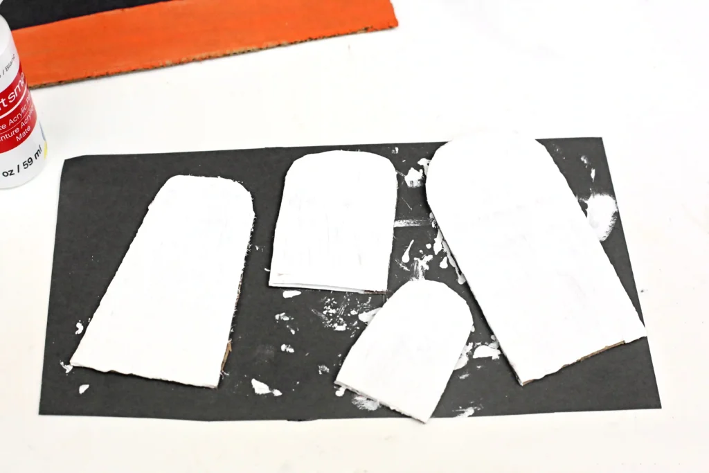 cardboard ghosts painted white