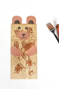 a paper bag decorated to look like a bear