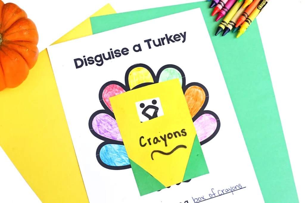 a print out of a turkey with construction paper on top that looks like a box of crayons