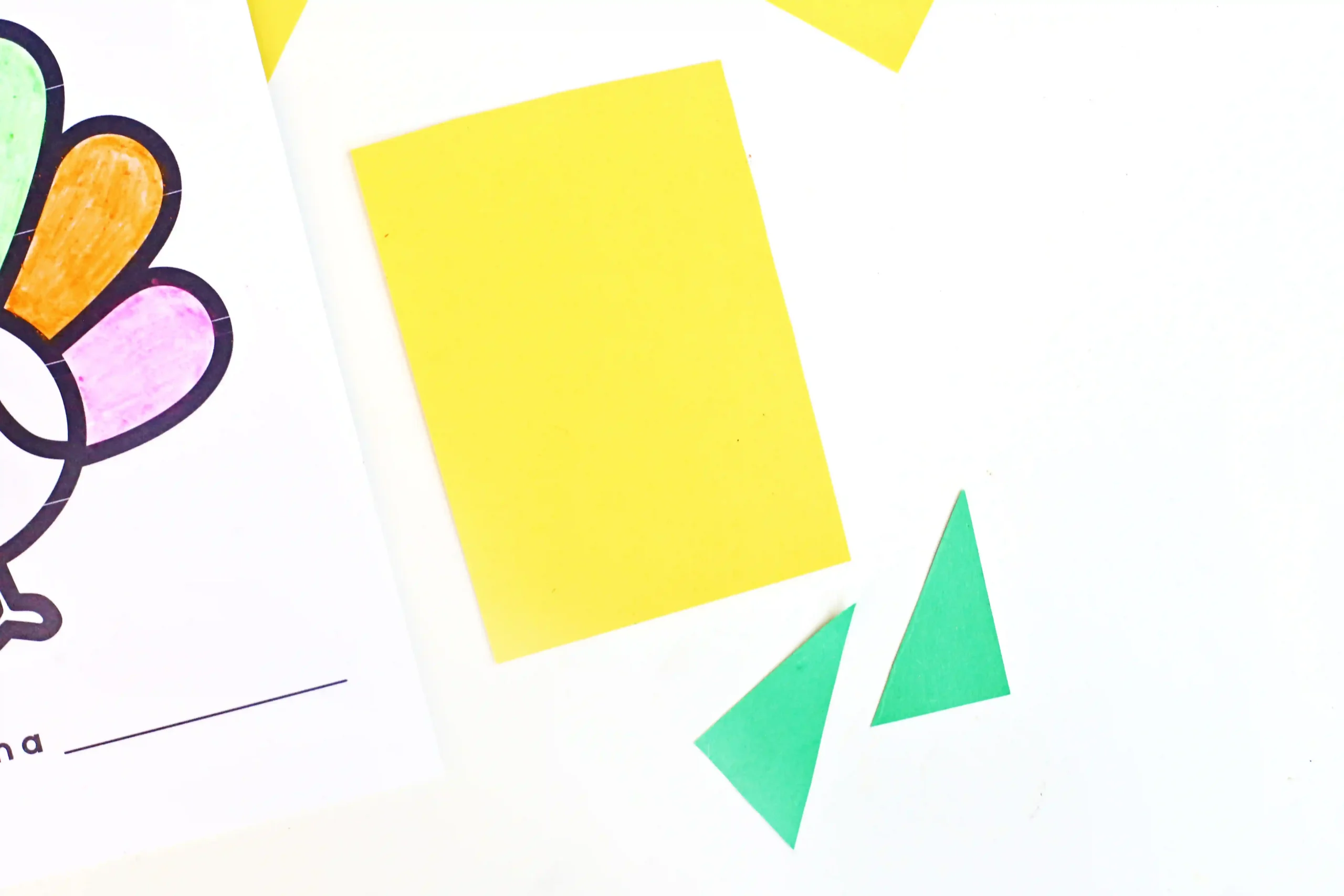 yellow construction paper rectangle and green triangles