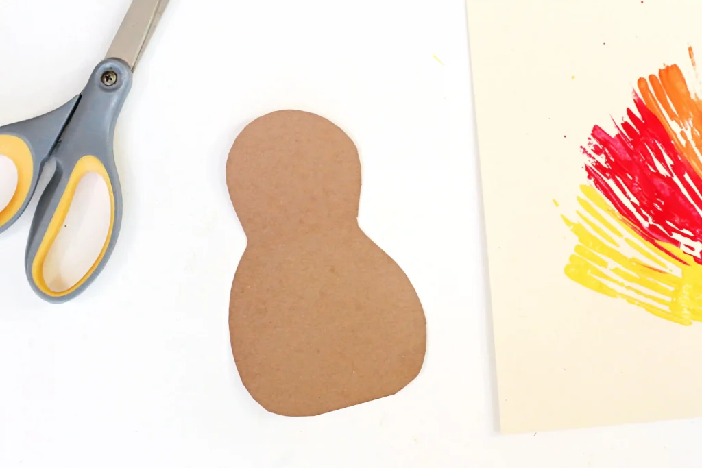 a turkey body cut out of brown construction paper